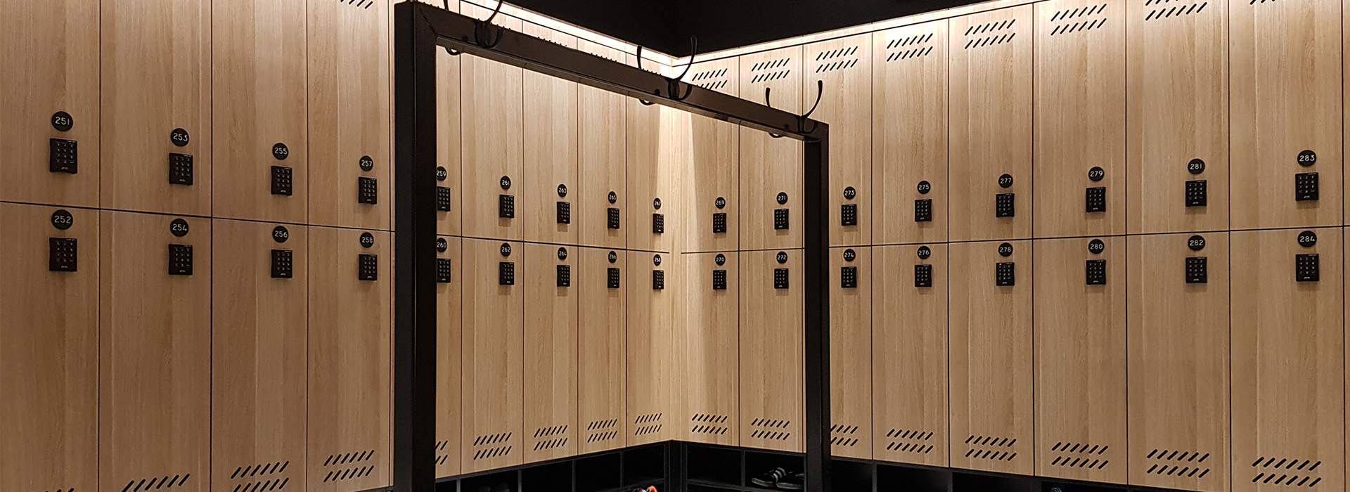Custom laminate lockers in woodgrain with black locks